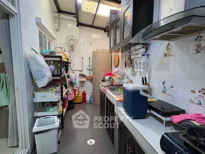 Cozy kitchen with ample storage and modern appliances, perfect for culinary enthusiasts.