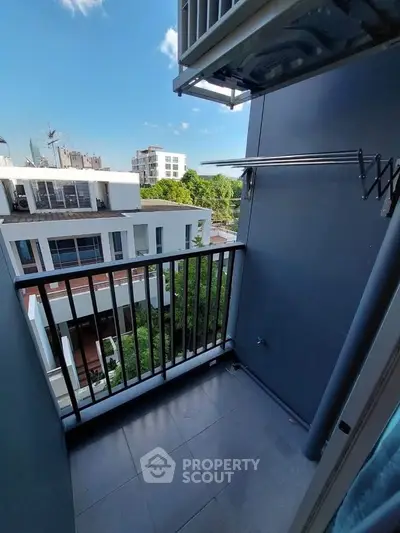 Charming balcony with urban view, perfect for relaxing and enjoying city life.
