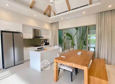 Spacious modern kitchen with open layout and elegant dining area in luxury home.