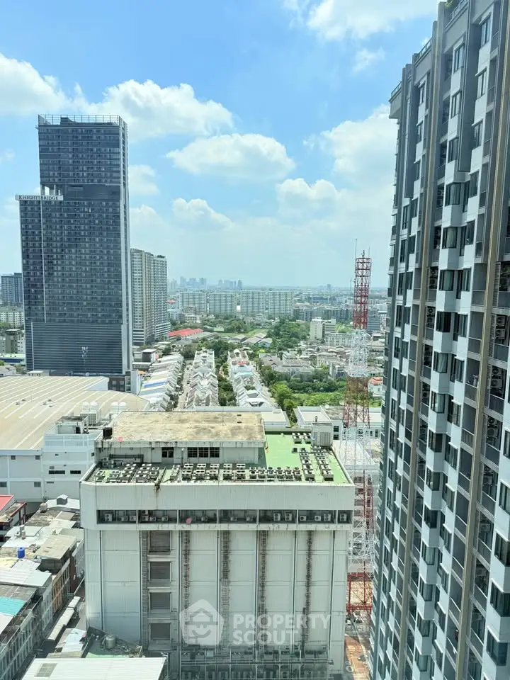 Stunning cityscape view from high-rise building showcasing urban skyline and modern architecture.