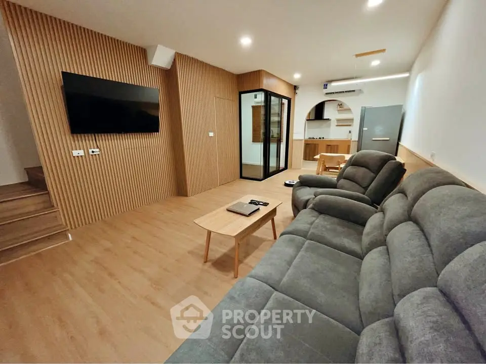 Modern living room with sleek design and cozy seating area