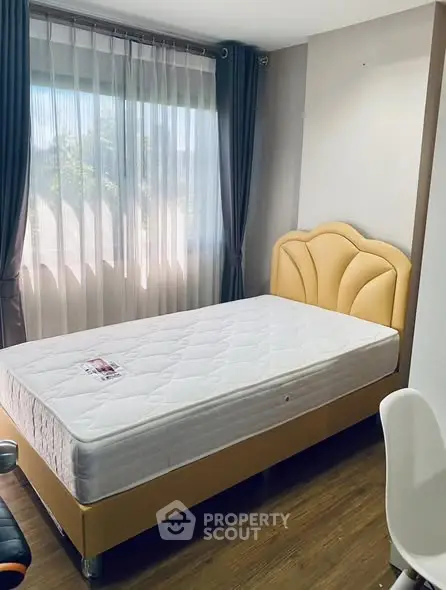 Cozy bedroom with natural light and stylish decor