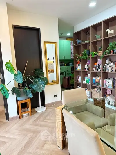 Stylish living room with modern decor and open shelving, featuring a cozy seating area and lush indoor plants.
