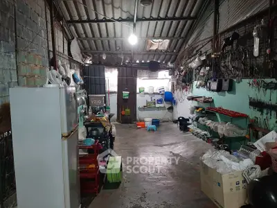 Spacious storage area with tools and appliances in a well-organized layout.