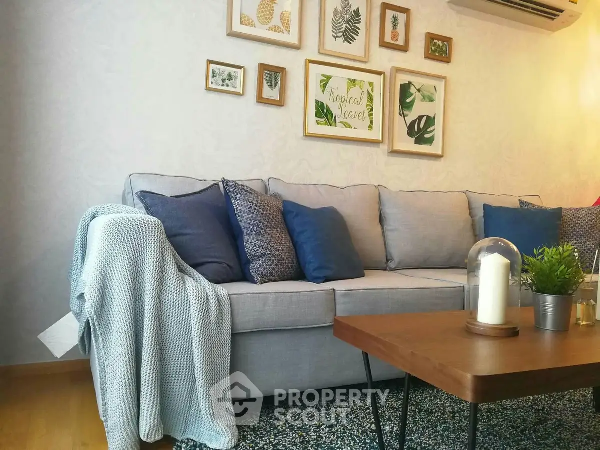 Chic living room with stylish decor, cozy sofa, and elegant wall art, perfect for modern living.