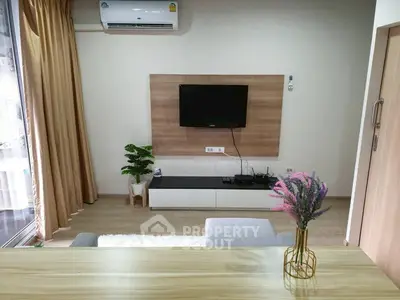 Modern living room with wall-mounted TV and stylish decor