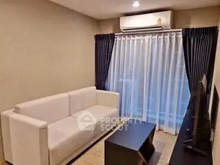 Cozy living room with modern sofa and large window drapes