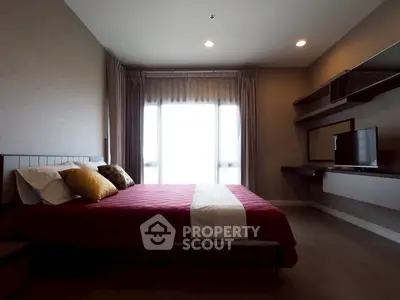 Modern bedroom with stylish decor and natural light