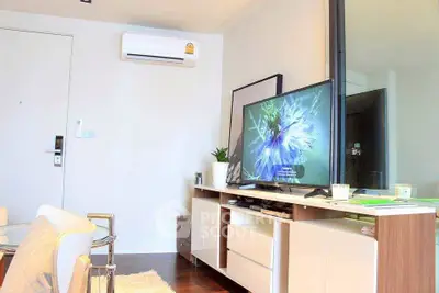 Modern living room with sleek TV unit and air conditioning