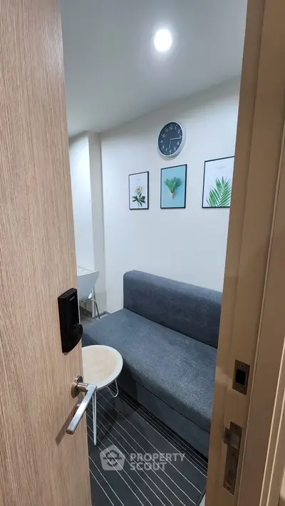 Cozy small living room with modern decor and wall art