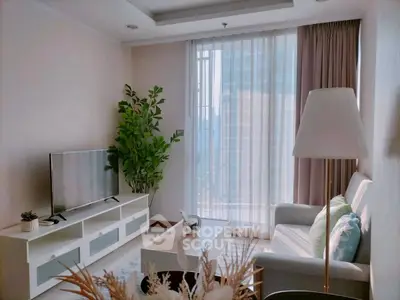 Bright and modern living room with large window and stylish decor