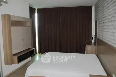 Modern bedroom with stylish wood accents and elegant drapery