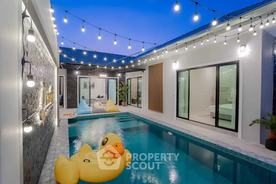 Luxurious modern villa with a private pool and stylish outdoor lighting, perfect for relaxation and entertainment.