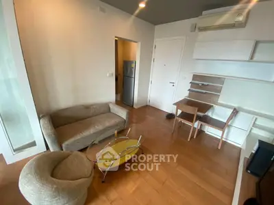Modern living room with stylish furniture and wooden flooring in a cozy apartment.