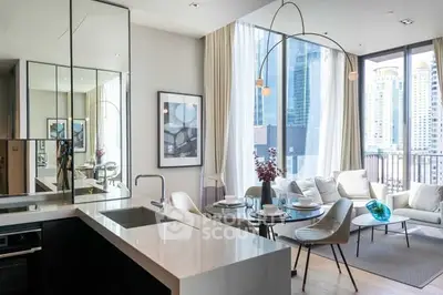 Modern open-plan living room with sleek kitchen and floor-to-ceiling windows offering city views.