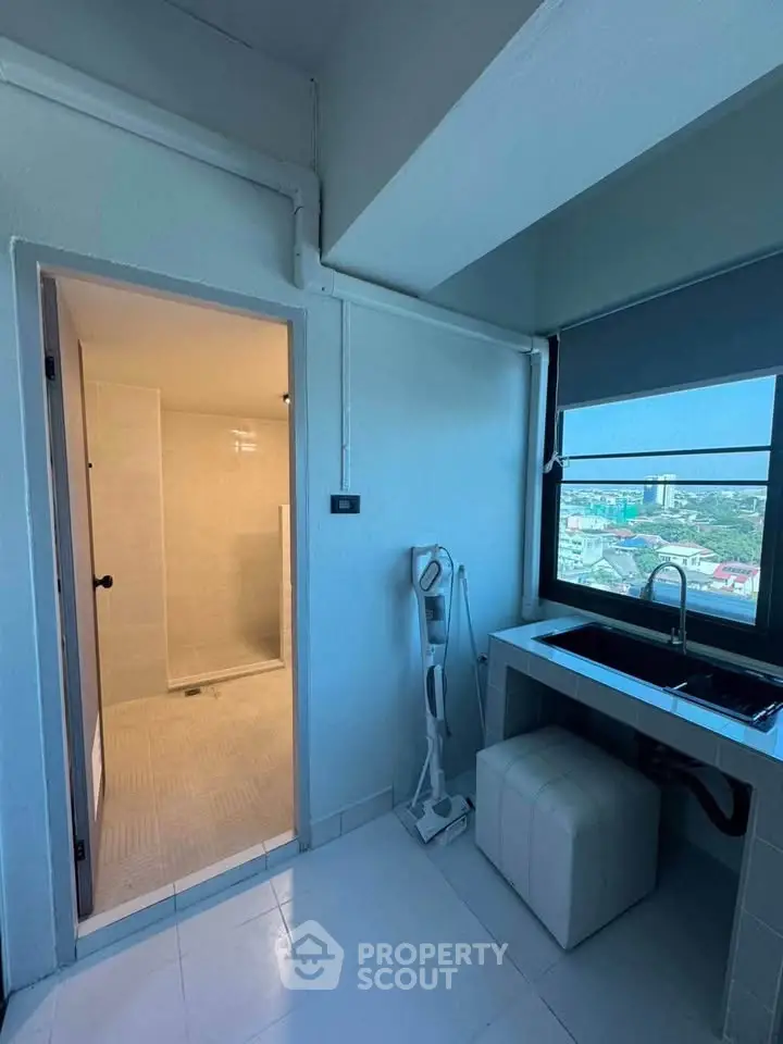 Modern laundry room with city view and sleek design