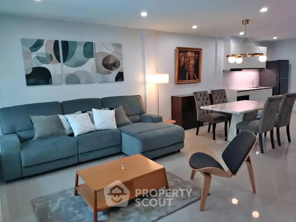Modern living room with stylish decor and open kitchen layout