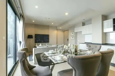Spacious modern living room with elegant dining area and large windows