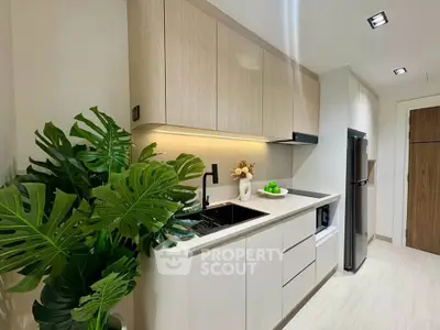 Modern kitchen with sleek cabinetry and stylish decor