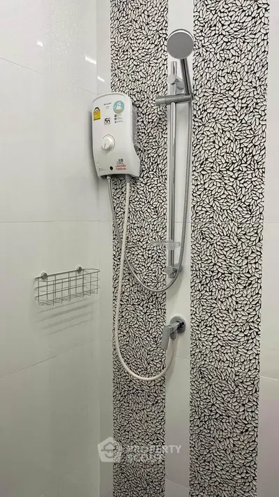 Modern bathroom shower with stylish tile design and electric water heater