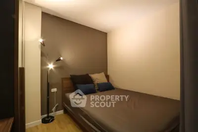 Cozy bedroom with modern lighting and neutral decor