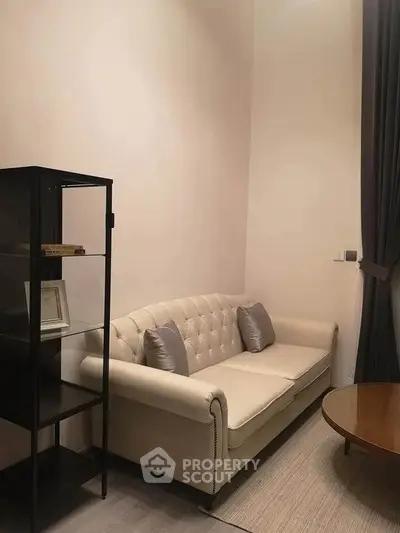 Cozy living room with elegant sofa and modern decor, perfect for relaxation and style.