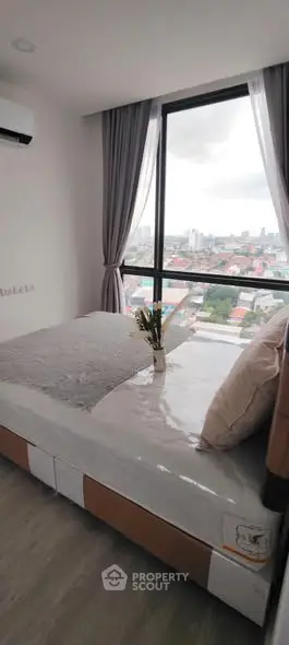Modern bedroom with panoramic city view and stylish decor