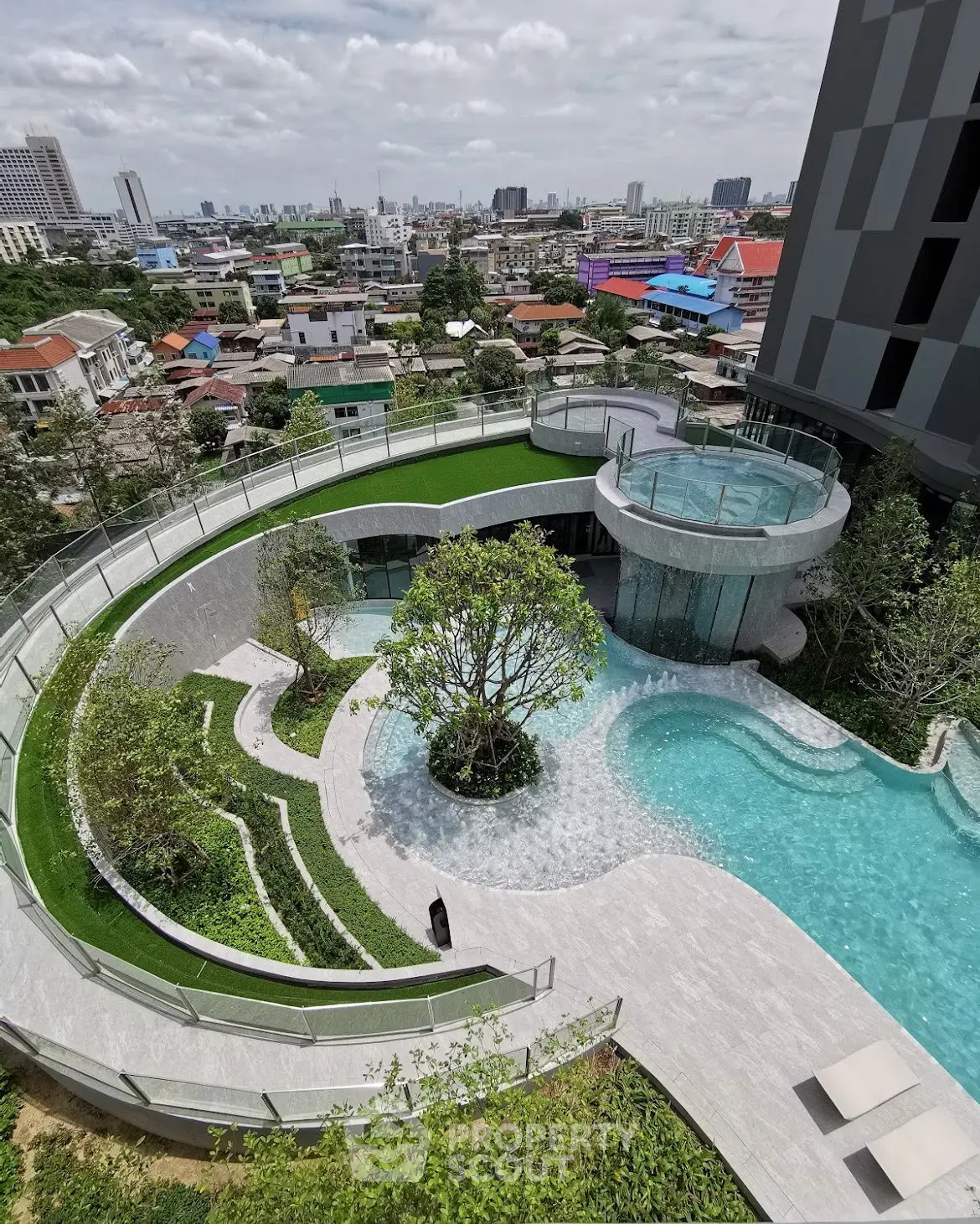 Stunning rooftop pool with panoramic city views in a modern urban setting.