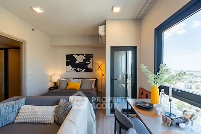 Modern studio apartment with stunning city view and stylish decor
