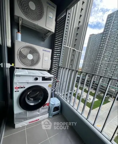 Modern high-rise balcony with washing machine and city view, perfect for urban living.