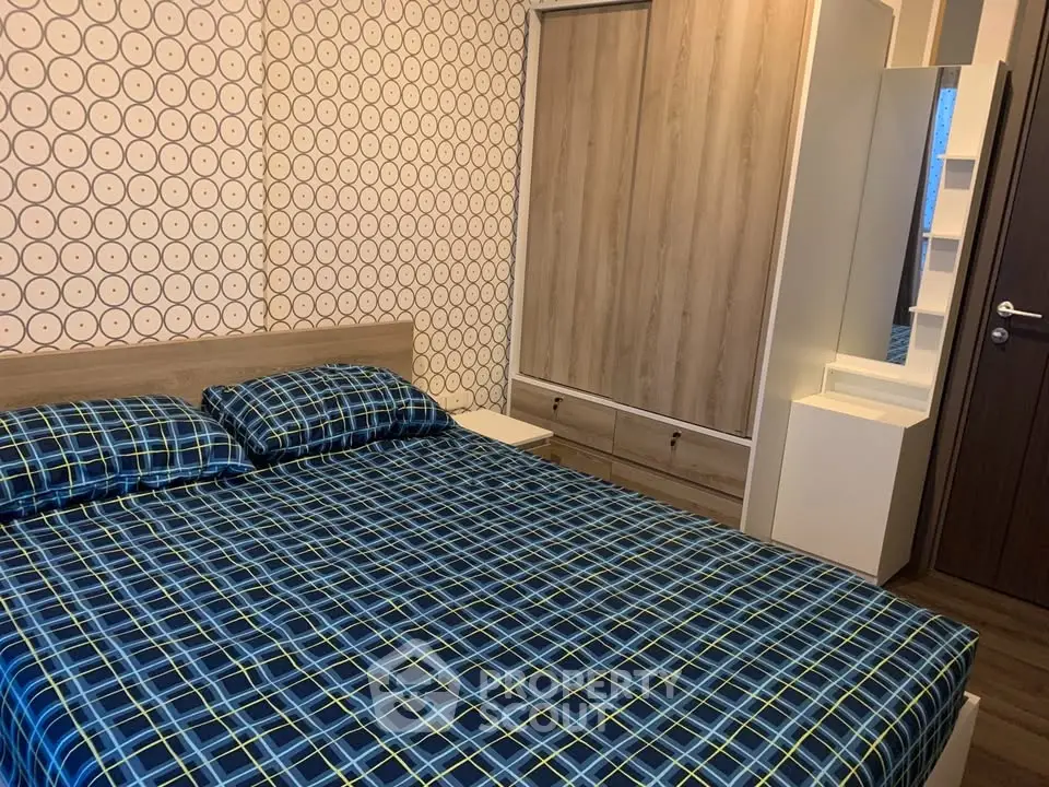 Cozy bedroom with modern decor and ample storage space