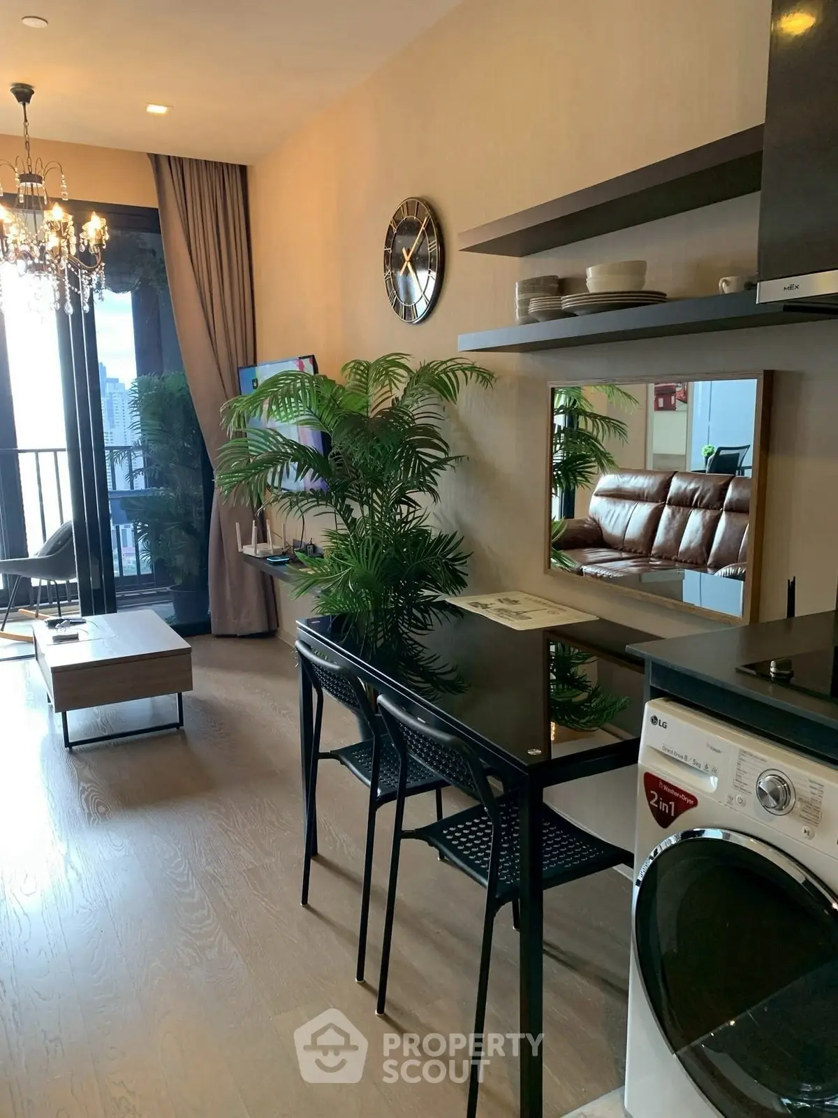 Stylish modern living room with balcony, elegant decor, and in-unit washer, perfect for urban living.