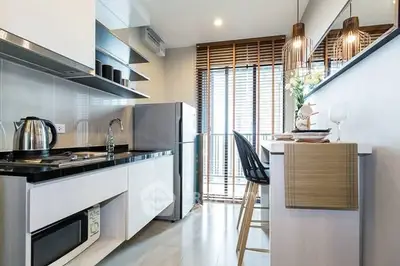 Modern kitchen with sleek design, featuring open layout and contemporary appliances.