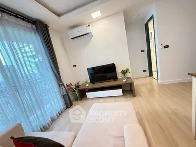 Modern living room with sleek design and city view, featuring air conditioning and stylish decor.