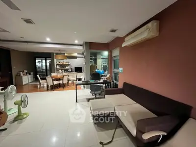 Spacious living room with modern furniture and open layout, perfect for family gatherings.