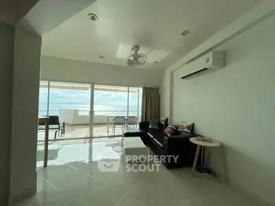 Spacious living room with ocean view and modern furnishings