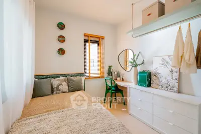 Charming bedroom with stylish decor, featuring a cozy bed, elegant dresser, and natural light from a window.