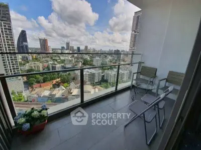 Stunning cityscape view from a spacious balcony in a high-rise apartment.