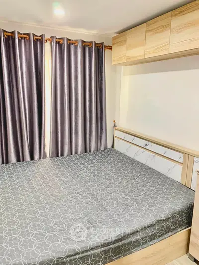 Cozy bedroom with modern wooden furniture and elegant curtains, perfect for relaxation.