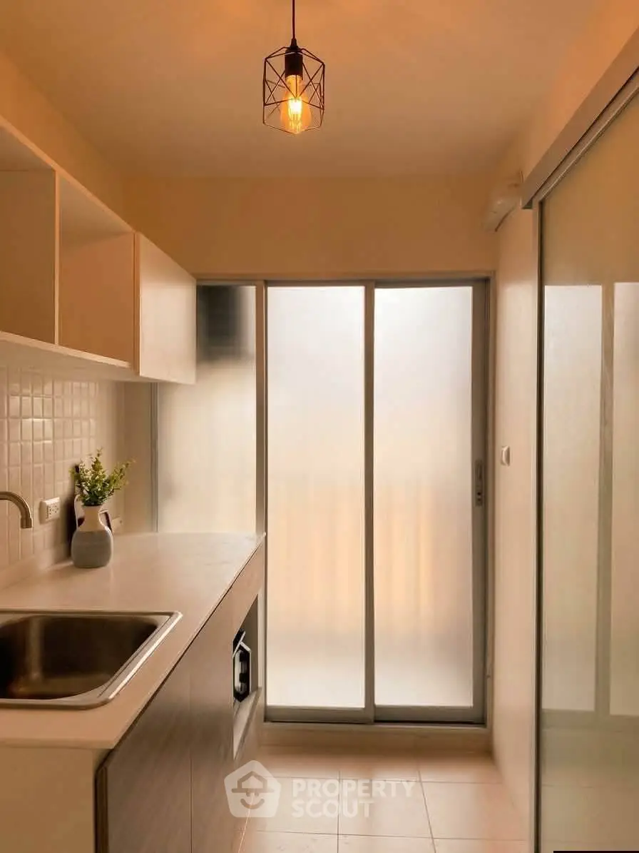 Modern kitchen with sleek design and frosted glass doors