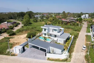 Stunning modern villa with pool and spacious garden in serene neighborhood.