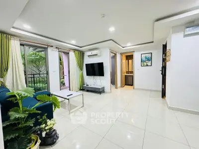 Spacious modern living room with large windows and stylish decor