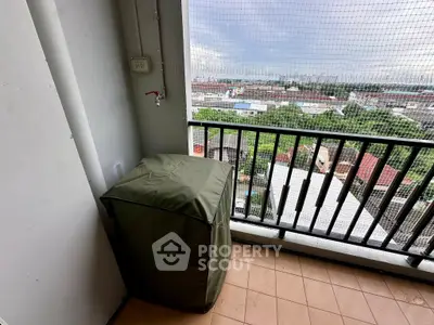 High-rise balcony with protective cover and city view