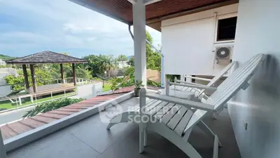 Charming balcony with scenic view and cozy seating in modern home