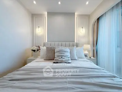 Luxurious bedroom with elegant decor and soft lighting, featuring a plush bed and stylish accents.