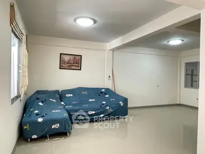 Spacious living room with minimalist decor and natural light