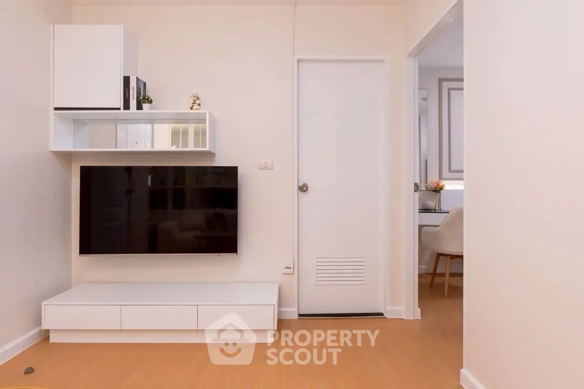 Modern living room with sleek TV unit and minimalist decor