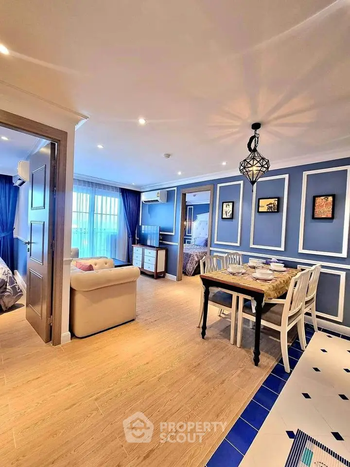 Charming open-plan living and dining area with elegant decor and natural light.