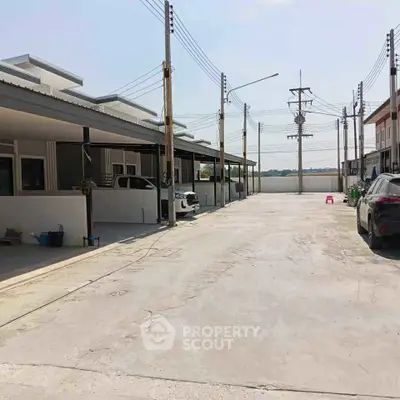 Spacious residential complex with ample parking and modern design, perfect for family living.