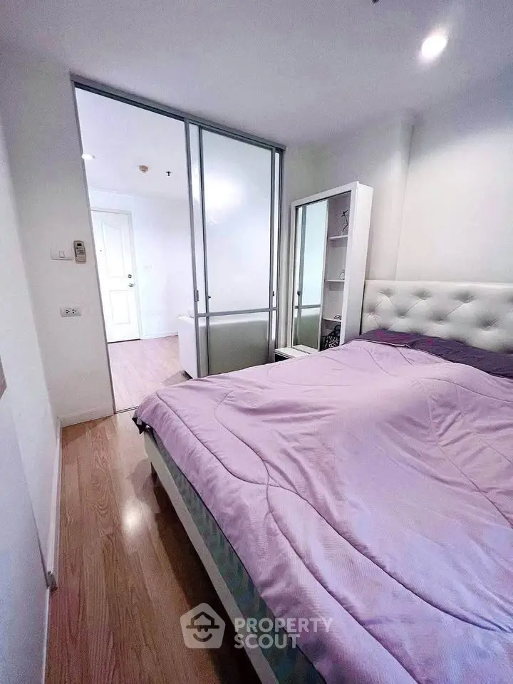 Cozy bedroom with modern decor and sliding glass door